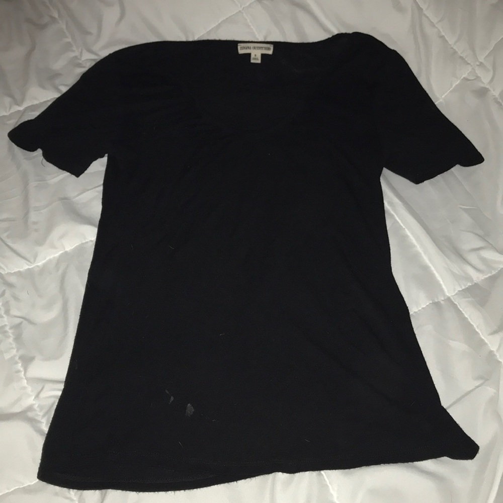 Thin T with cross detail on neck.